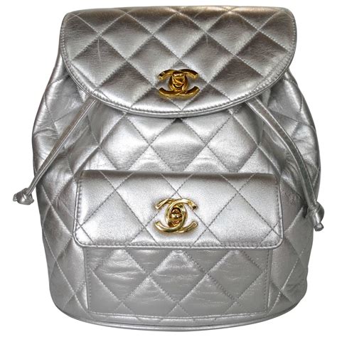 silver chanel backpack|metallic crocodile textured backpack.